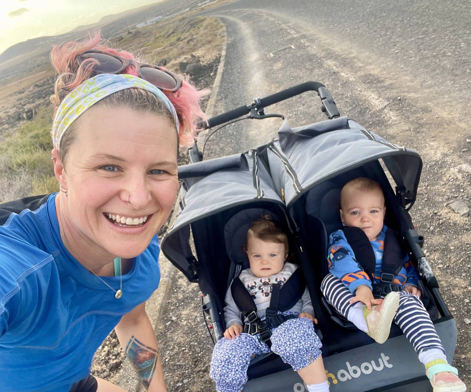 Anna McNuff running with her twins in a running buggy